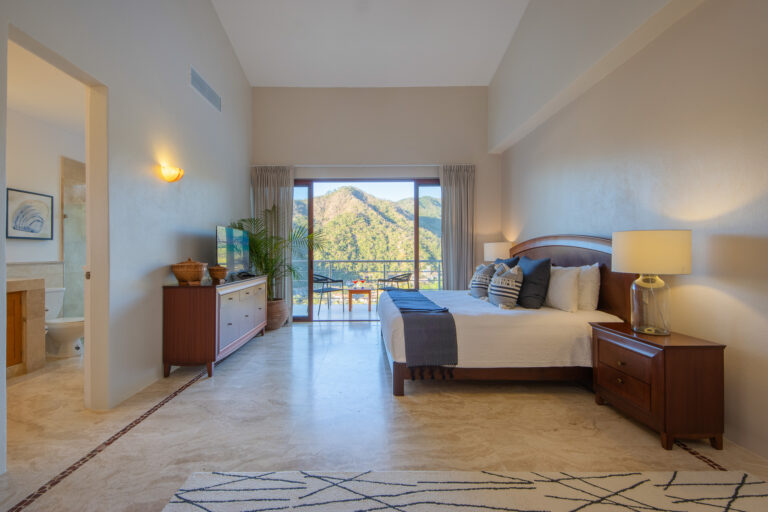 Villa Magnifico Luxury vacation Villa in Mismaloya, near Puerto Vallarta: Spacious bedroom features a balcony with mountain views.