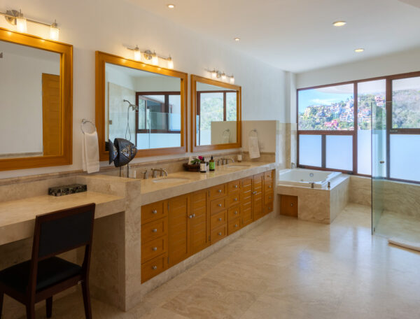 Villa Magnifico Luxurious Mismaloya Villa, near Puerto Vallarta: Spacious bathroom with wooden vanity, bathtub with scenic view, and walk-in shower.