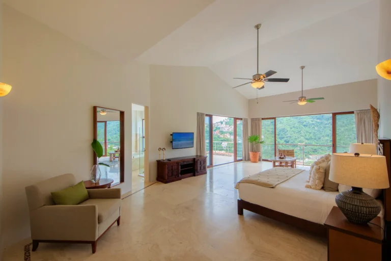 Villa Magnifico Luxury villa room in Mismaloya, near Puerto Vallarta: spacious with balcony views of green hills.