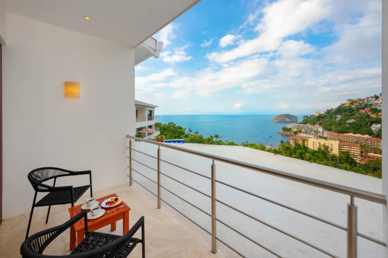 Villa Magnifico Balcony at luxury Villa in Mismaloya, near Puerto Vallarta, Mexico; ocean view, chairs, table with tea set.