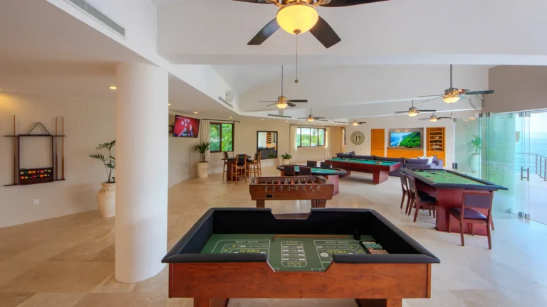 Villa Magnifico Game room with casino tables, ceiling fans; overlooks ocean. Located in Mismaloya near Puerto Vallarta, Mexico.