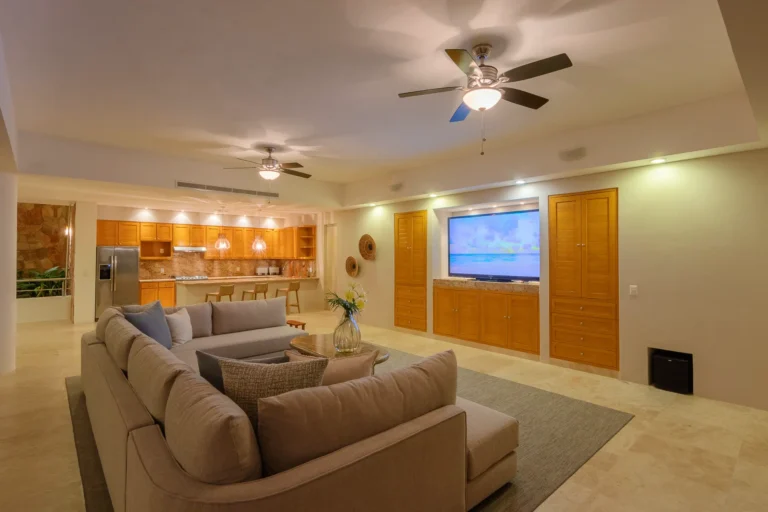 Villa Magnifico Open living area of luxury villa in Mismaloya, near Puerto Vallarta, Mexico with beige sofa and modern kitchen.